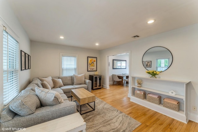32 Henderson Ave, Port Washington, NY 11050 - living room with light wood-type flooring, recessed lighting, and baseboards