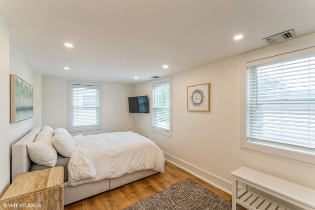 32 Henderson Ave, Port Washington, NY 11050 - bedroom with wood finished floors, recessed lighting, and baseboards