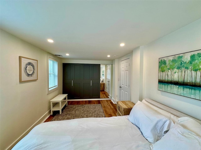 32 Henderson Ave, Port Washington, NY 11050 - bedroom with wood finished floors, recessed lighting, and baseboards