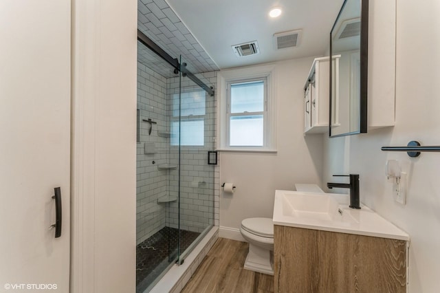 32 Henderson Ave, Port Washington, NY 11050 - full bathroom featuring vanity, toilet, wood finished floors, a stall shower, and baseboards