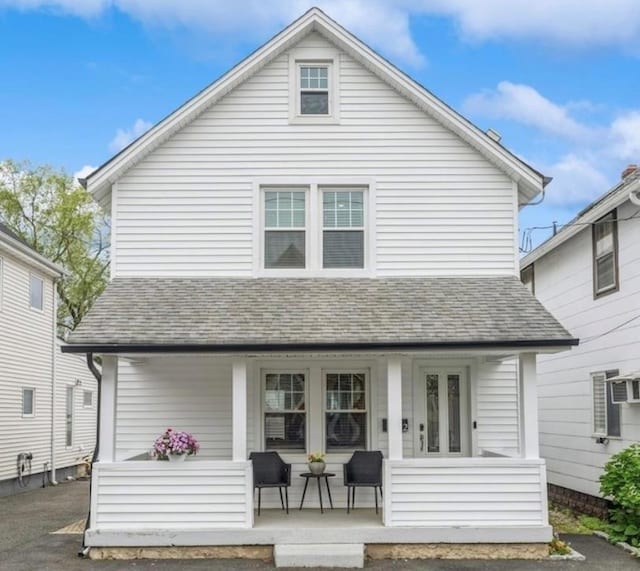 32 Henderson Ave, Port Washington, NY 11050 - rear view of property featuring covered porch and a shingled roof