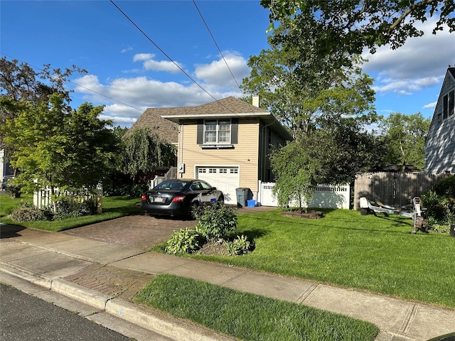 2713 Fox Rd, Baldwin, NY 11510 - view of front of house featuring decorative driveway, a chimney, and a garage
