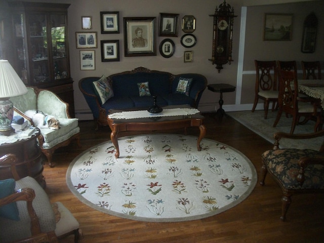 2713 Fox Rd, Baldwin, NY 11510 - living room with wood finished floors, baseboard heating, and baseboards