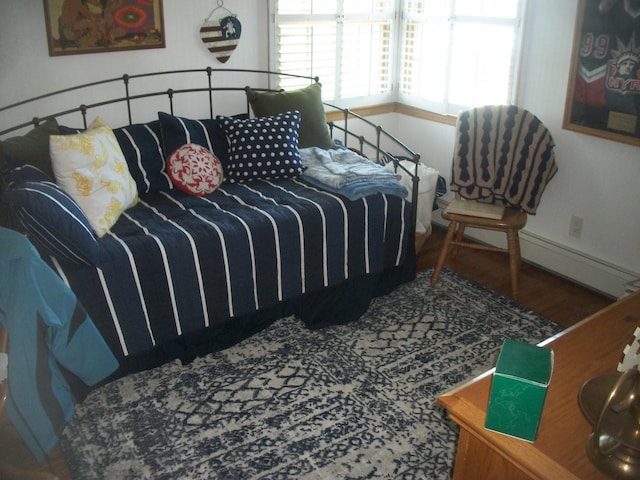 2713 Fox Rd, Baldwin, NY 11510 - bedroom featuring wood finished floors and baseboards