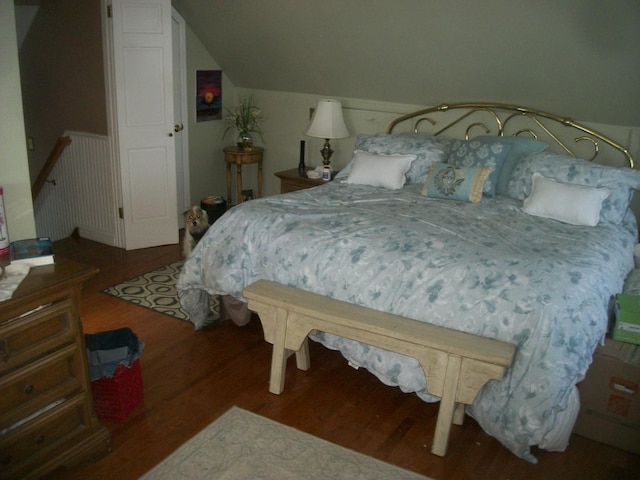2713 Fox Rd, Baldwin, NY 11510 - bedroom with wood finished floors and vaulted ceiling