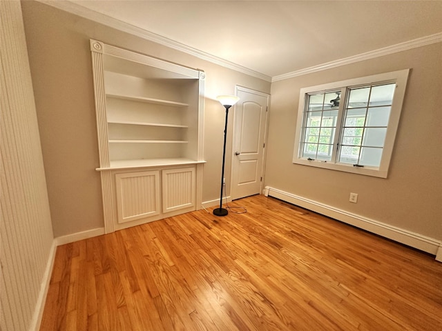 3206 Sharon Tpke, Millbrook, NY 12545 - unfurnished bedroom with baseboard heating, light wood-style flooring, ornamental molding, and baseboards