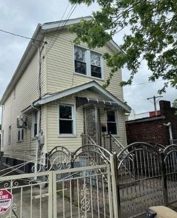116-12 127th St, Ozone Park, NY 11420 - view of front of house with a gate