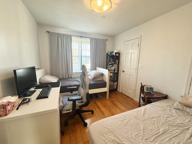 103-02 42nd Ave Unit 4D, Corona, NY 11368 - bedroom featuring light wood-type flooring and a desk