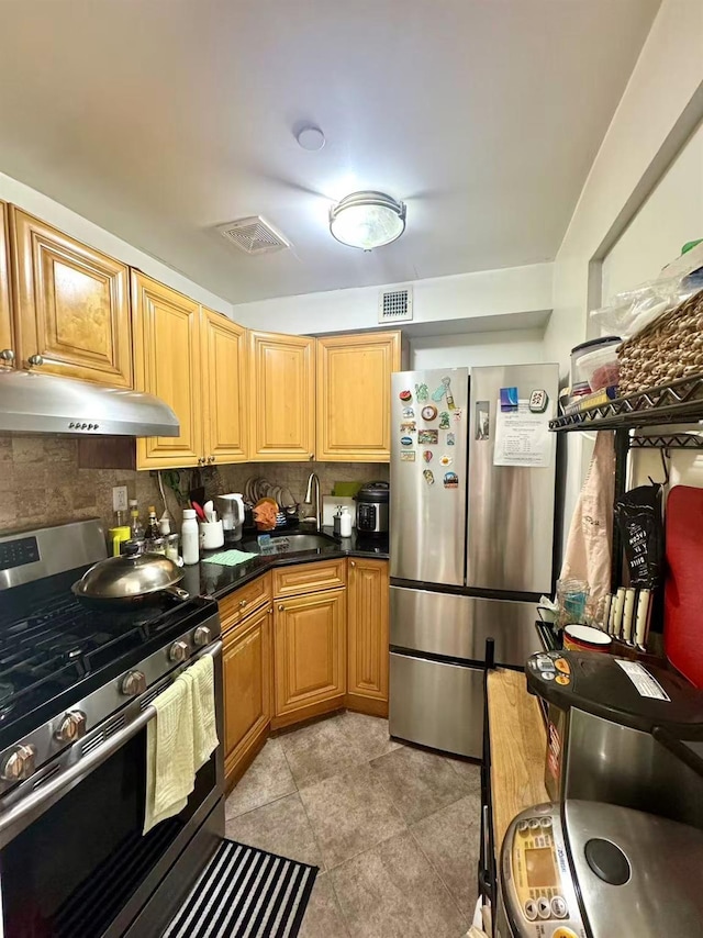 103-02 42nd Ave Unit 4D, Corona, NY 11368 - kitchen featuring appliances with stainless steel finishes, under cabinet range hood, backsplash, light tile patterned flooring, and dark countertops