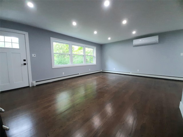 495 Stanton Ter, Poughkeepsie, NY 12603 - unfurnished living room featuring an AC wall unit, recessed lighting, plenty of natural light, wood finished floors, and a baseboard heating unit