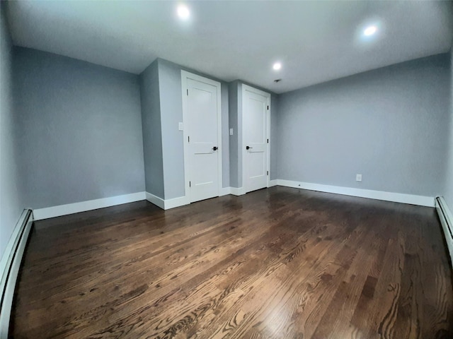 495 Stanton Ter, Poughkeepsie, NY 12603 - additional living space with baseboard heating, baseboards, dark wood-style flooring, and recessed lighting