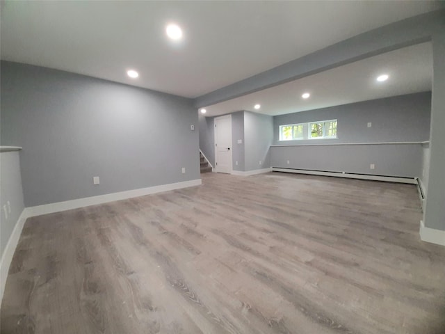 495 Stanton Ter, Poughkeepsie, NY 12603 - unfurnished room with recessed lighting, stairs, light wood-type flooring, a baseboard radiator, and baseboards