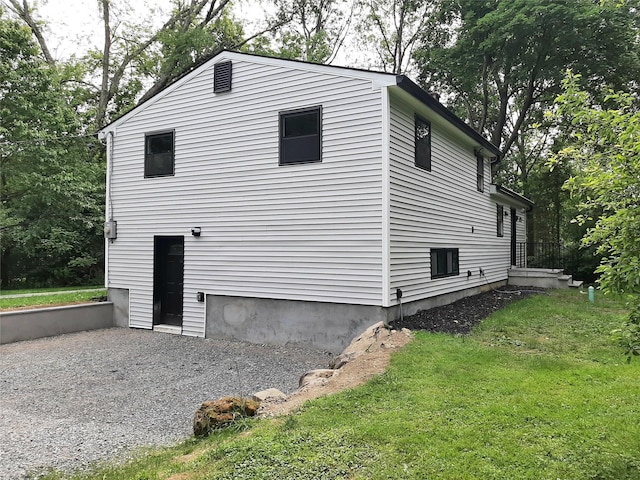 495 Stanton Ter, Poughkeepsie, NY 12603 - view of side of home with a lawn