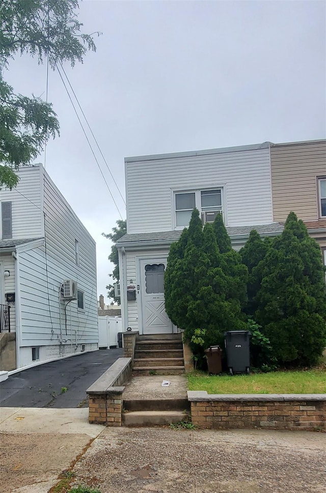 202-09 33rd Ave, Bayside, NY 11361 - view of front of home with entry steps and driveway