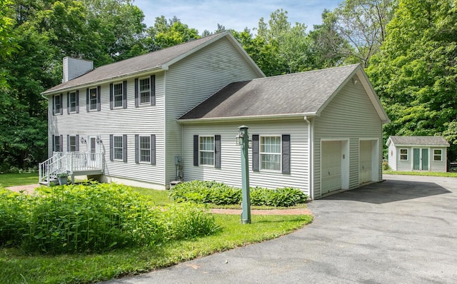 36 Valkill Dr, Poughkeepsie, NY 12601 - colonial inspired home featuring a chimney, a shingled roof, and a garage