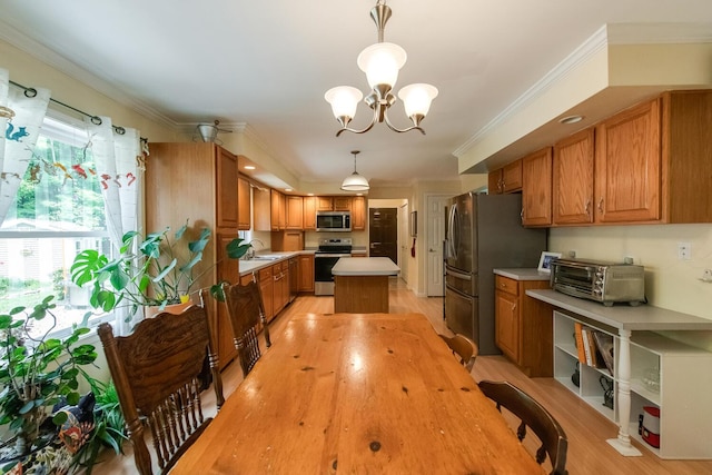 36 Valkill Dr, Poughkeepsie, NY 12601 - kitchen with stainless steel appliances, light countertops, a chandelier, brown cabinetry, and light wood-style floors