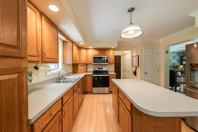 36 Valkill Dr, Poughkeepsie, NY 12601 - kitchen featuring stainless steel appliances, a sink, light wood-type flooring, light countertops, and brown cabinetry