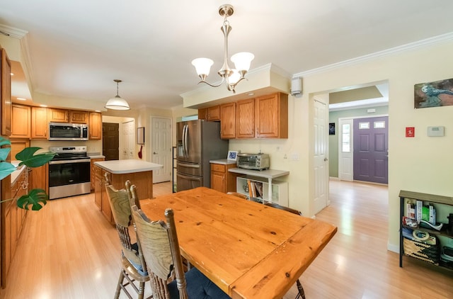 36 Valkill Dr, Poughkeepsie, NY 12601 - dining area with ornamental molding, light wood-style floors, a chandelier, and baseboards