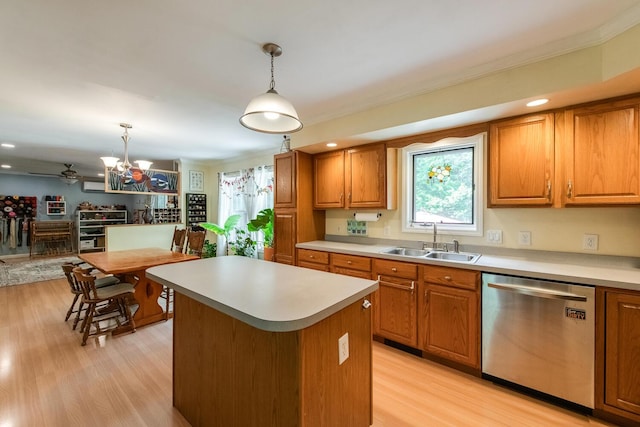 36 Valkill Dr, Poughkeepsie, NY 12601 - kitchen featuring dishwasher, a sink, brown cabinetry, light wood-style flooring, and crown molding