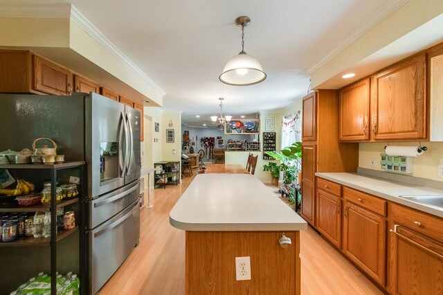 36 Valkill Dr, Poughkeepsie, NY 12601 - kitchen with stainless steel fridge, light wood-style flooring, a kitchen island, a chandelier, and crown molding