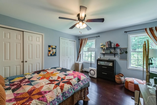 36 Valkill Dr, Poughkeepsie, NY 12601 - bedroom with multiple closets, dark wood-style floors, a ceiling fan, and baseboard heating