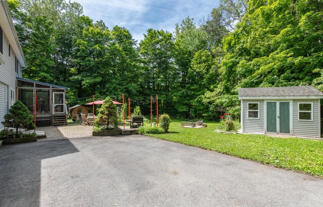 36 Valkill Dr, Poughkeepsie, NY 12601 - view of patio featuring an outdoor structure and a sunroom