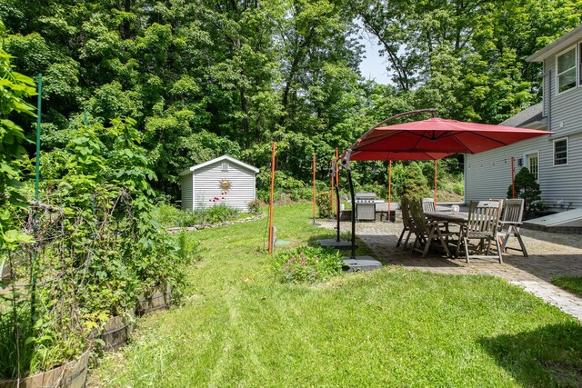 36 Valkill Dr, Poughkeepsie, NY 12601 - view of green lawn featuring a patio and outdoor dining area