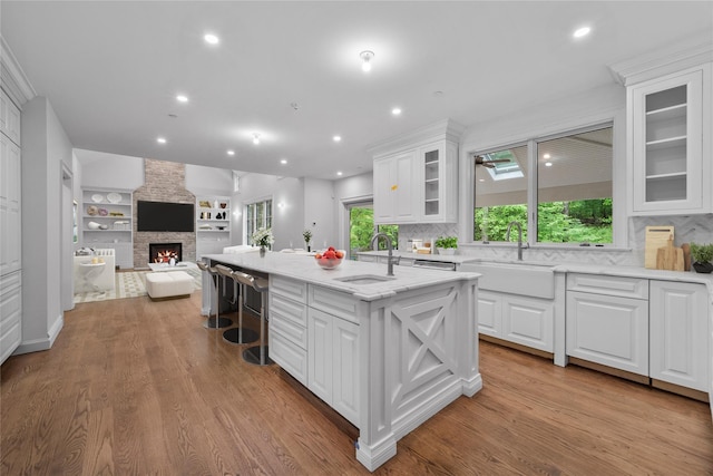 3 Hageman Ct, Katonah, NY 10536 - kitchen featuring a sink, a kitchen island with sink, white cabinets, and recessed lighting