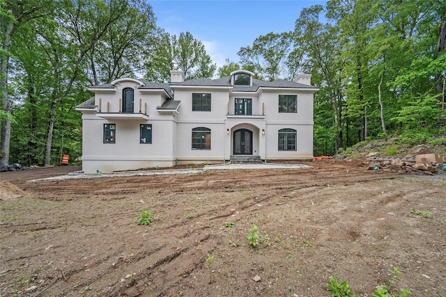 3 Hageman Ct, Katonah, NY 10536 - french country style house with stucco siding, french doors, and a chimney