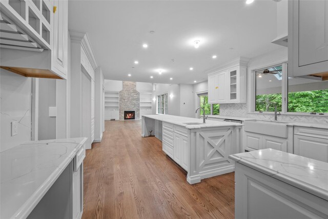 3 Hageman Ct, Katonah, NY 10536 - kitchen featuring a sink, light wood-type flooring, a fireplace, and recessed lighting