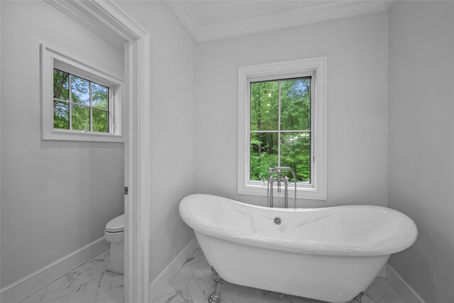 3 Hageman Ct, Katonah, NY 10536 - bathroom with baseboards, marble finish flooring, a freestanding bath, ornamental molding, and toilet