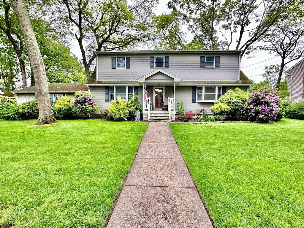 1134 Jefferson Ave, West Islip, NY 11795 - view of front of property featuring a front yard