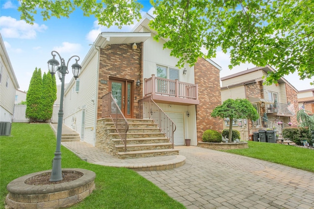 63 Dorval Ave, Staten Island, NY 10312 - view of front of property with brick siding, a garage, a front lawn, and a balcony