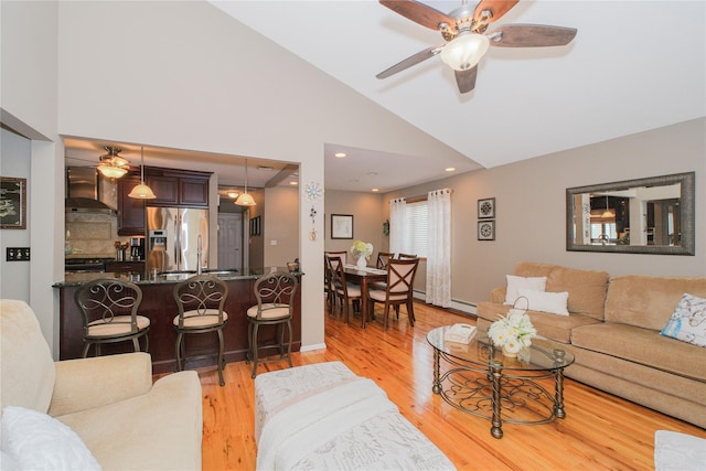 63 Dorval Ave, Staten Island, NY 10312 - living room featuring ceiling fan, light wood-style flooring, and high vaulted ceiling