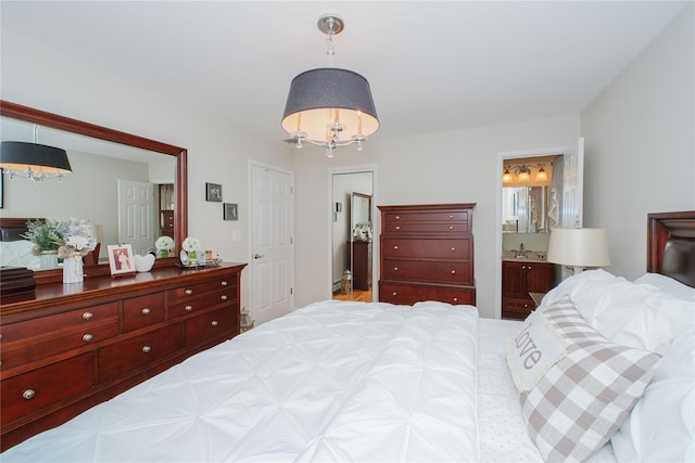 63 Dorval Ave, Staten Island, NY 10312 - bedroom with a chandelier, ensuite bath, and a sink