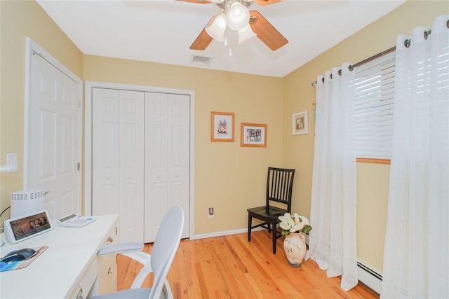 63 Dorval Ave, Staten Island, NY 10312 - office area featuring a ceiling fan, light wood-type flooring, a baseboard radiator, and baseboards