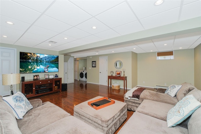 63 Dorval Ave, Staten Island, NY 10312 - living room with washer and dryer, baseboard heating, wood finished floors, a drop ceiling, and recessed lighting