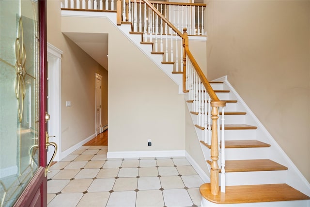 10 Stewart St, East Islip, NY 11730 - entryway with stairs, baseboards, and a high ceiling