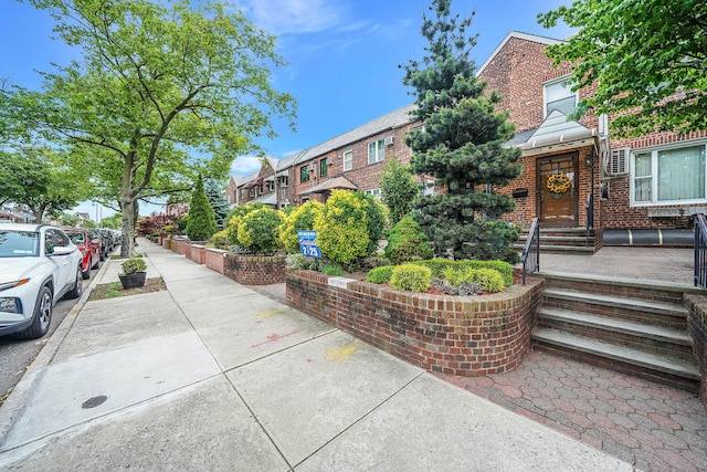 60-51 71st St, Maspeth, NY 11378 - view of front of house featuring brick siding and a residential view
