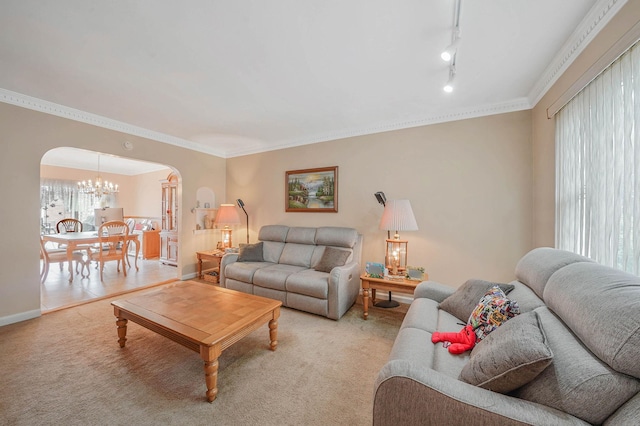 60-51 71st St, Maspeth, NY 11378 - living area with arched walkways, light colored carpet, a chandelier, ornamental molding, and baseboards