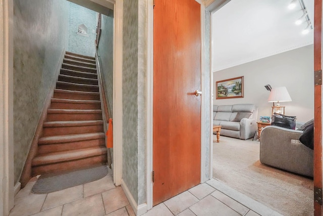 60-51 71st St, Maspeth, NY 11378 - stairs featuring tile patterned floors, rail lighting, carpet floors, and ornamental molding