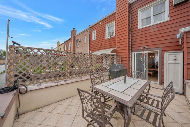 60-51 71st St, Maspeth, NY 11378 - view of patio featuring grilling area and outdoor dining area