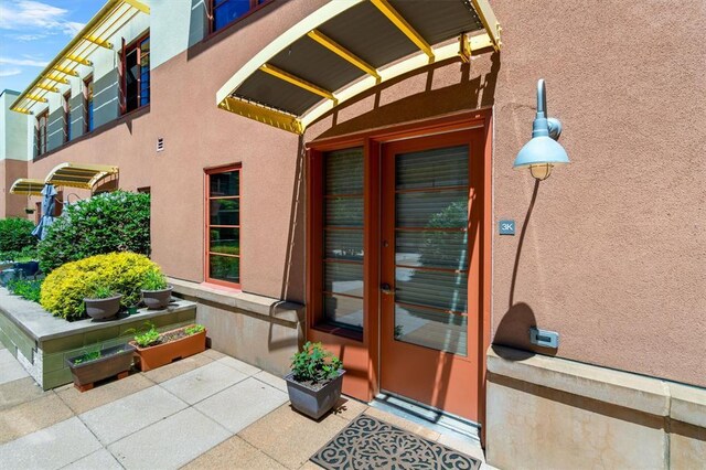 45 Main St Unit 3K, Hastings-On-Hudson, NY 10706 - view of exterior entry featuring stucco siding