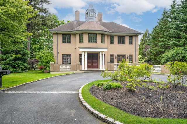 30A Shelter Rock Rd, Manhasset, NY 11030 - view of front facade with a chimney
