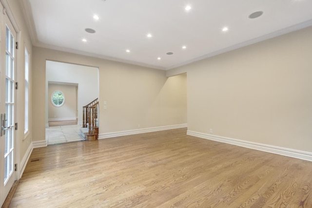 30A Shelter Rock Rd, Manhasset, NY 11030 - empty room with stairs, light wood-style floors, ornamental molding, recessed lighting, and baseboards