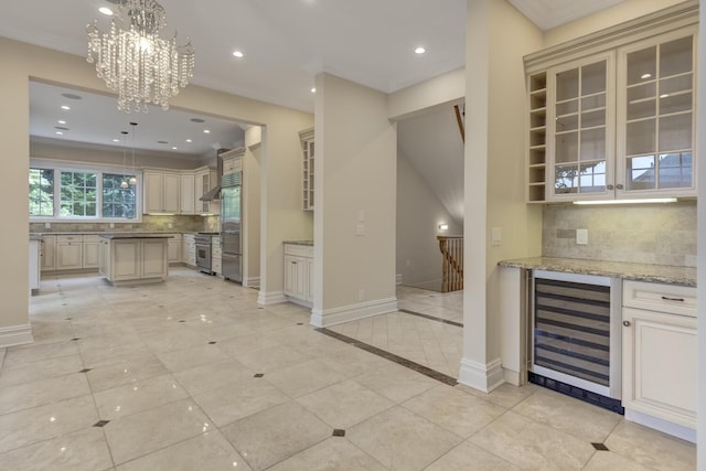 30A Shelter Rock Rd, Manhasset, NY 11030 - kitchen featuring beverage cooler, cream cabinets, backsplash, high quality appliances, and recessed lighting