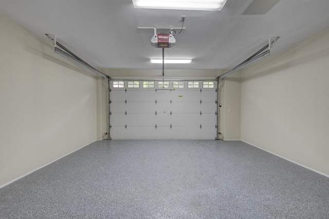 30A Shelter Rock Rd, Manhasset, NY 11030 - garage with a garage door opener and baseboards