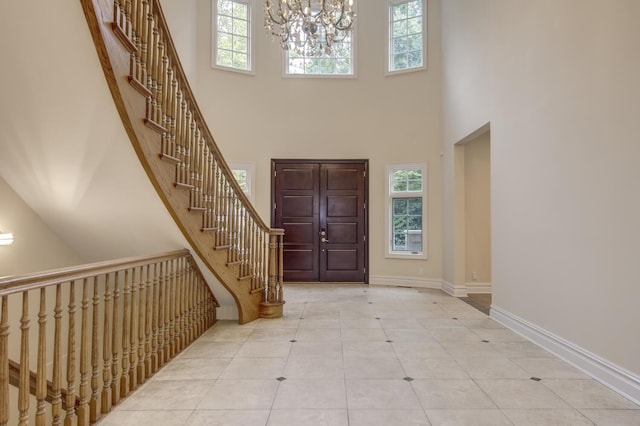 30A Shelter Rock Rd, Manhasset, NY 11030 - tiled foyer featuring a towering ceiling, a chandelier, stairway, and baseboards