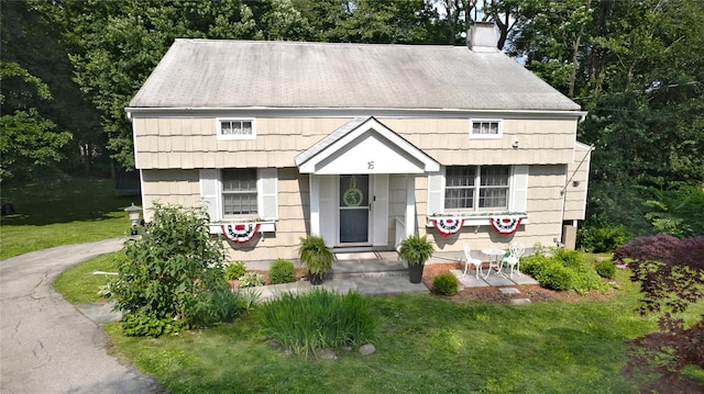 16 Lyncrest Rd, Cortlandt Manor, NY 10567 - view of front of property with a chimney and a front lawn