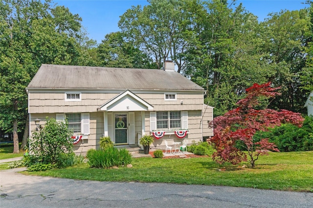 16 Lyncrest Rd, Cortlandt Manor, NY 10567 - view of front of property featuring a chimney and a front yard